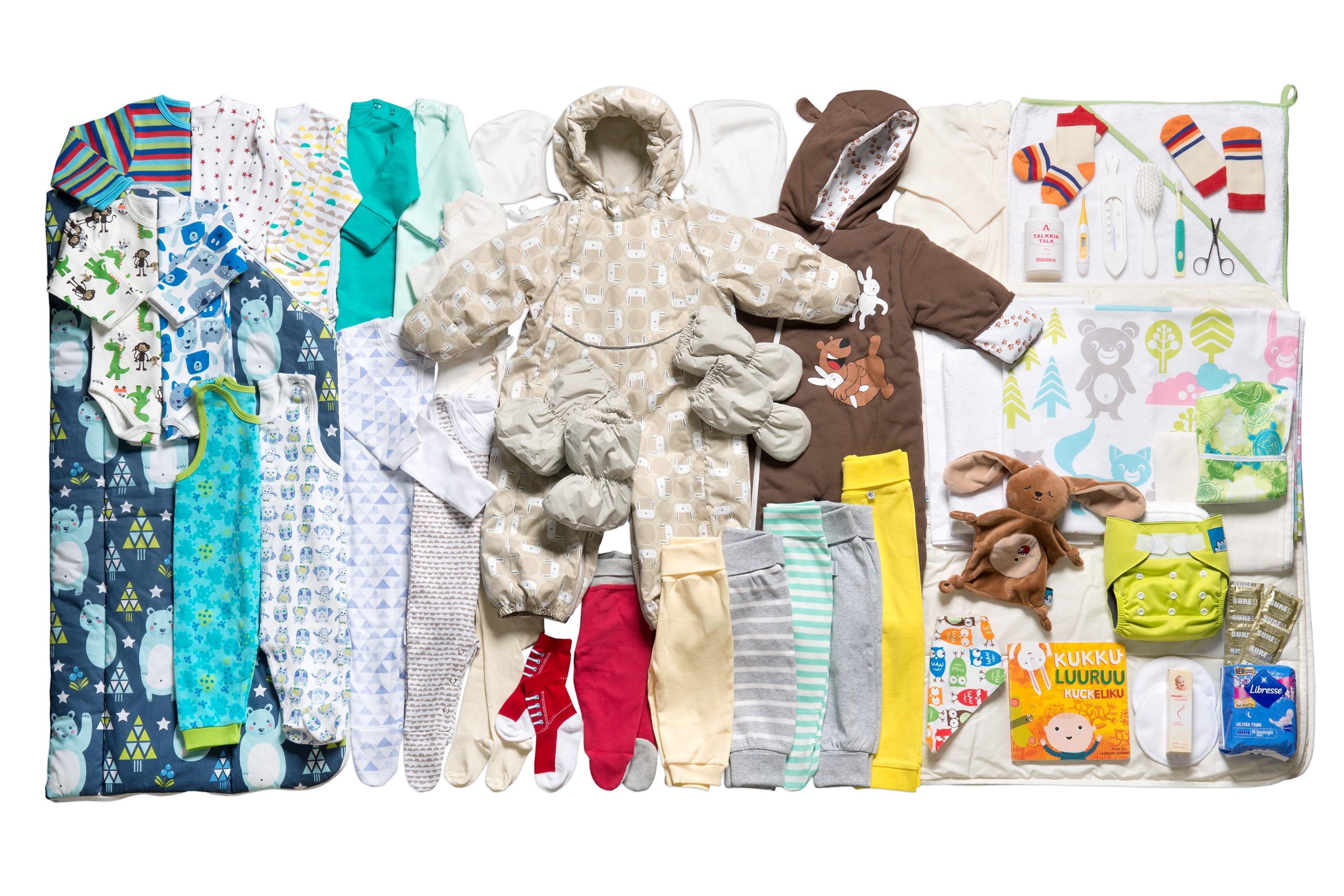 Example of the items included in the Finnish maternity package, including baby clothing, toys, nappies, a children's book, and more