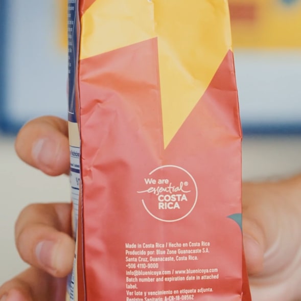 A coffee bag displaying the essential COSTA RICA logo